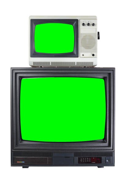 istock Two old vintage TVs with a green screen for adding video, isolated on a white background. 1298270804