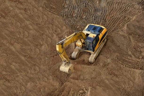 istock Excavator on earthworks. Backhoe on groundwork for road construction. 1298272681