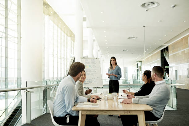istock Gathered for a weekly management meeting 1298272978