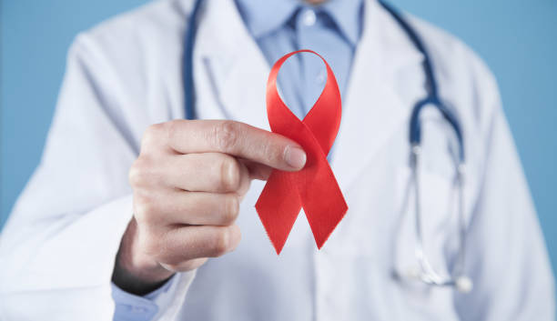 istock Caucasian doctor holds a red ribbon. 1298278526