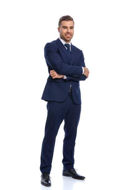 istock attractive bearded guy in elegant suit crossing arms and smiling 1298278736