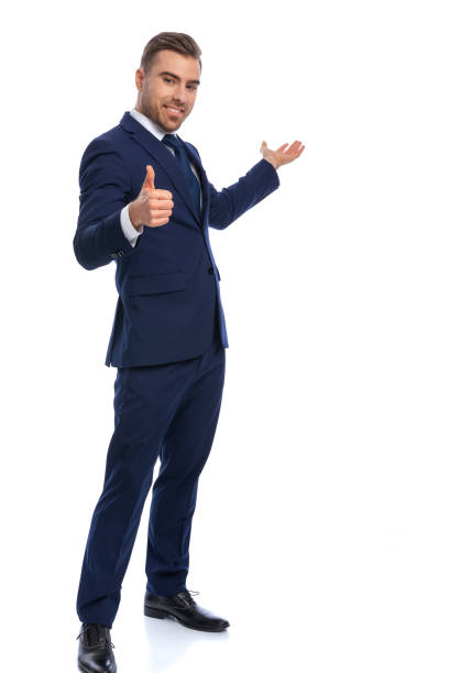 istock happy young businessman making thumbs up gesture and smiling 1298278920