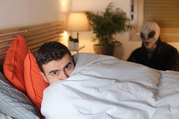 istock Man about to be abducted by alien 1298279107