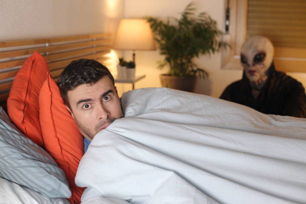 istock Man about to be abducted by alien 1298279951