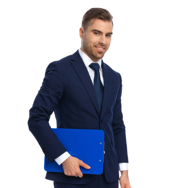 istock side view of smiling businessman holding clipboard 1298281072