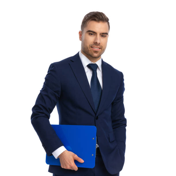 istock attractive unshaved guy holding hand in pocket and smiling 1298281097