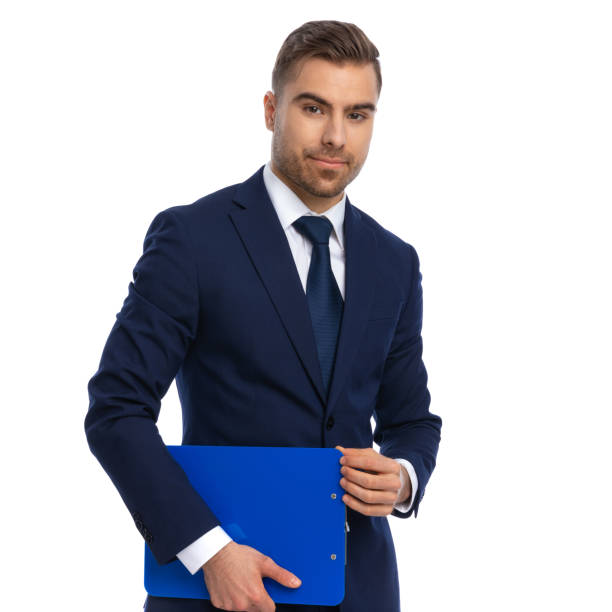 istock confident businessman in suit holding clipboard 1298281378