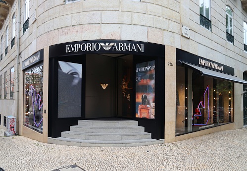 Emporio Armani fashion shop at Avenida da Liberdade in Lisbon. This famous boulevard is renowned for luxury brand shopping and prime real estate.