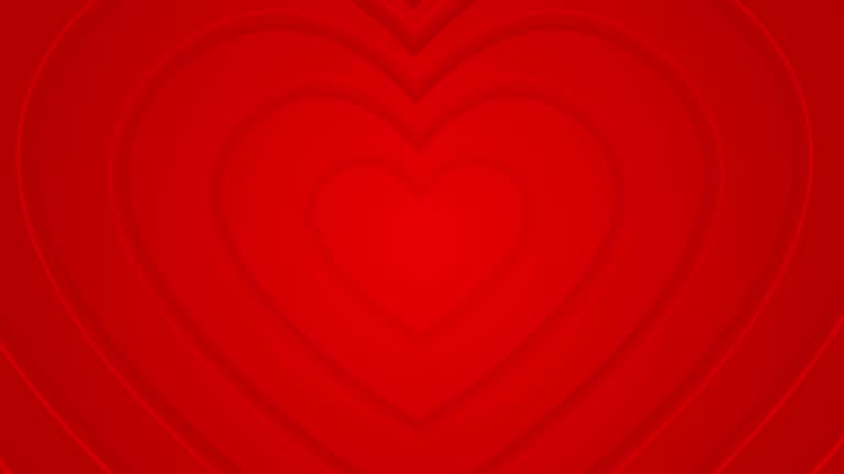 Hot red hearts move from center. 4k seamless looped animated background.