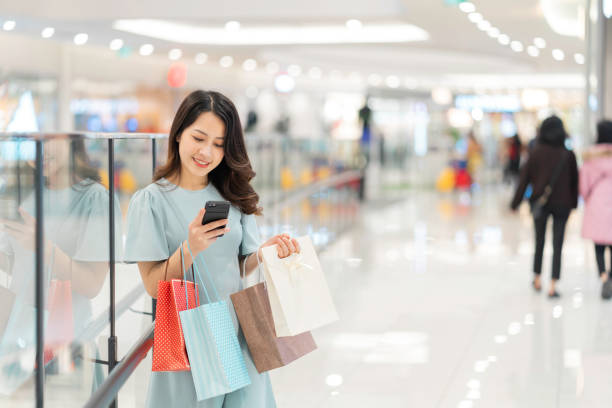 istock Asian woman shopping 1298284351