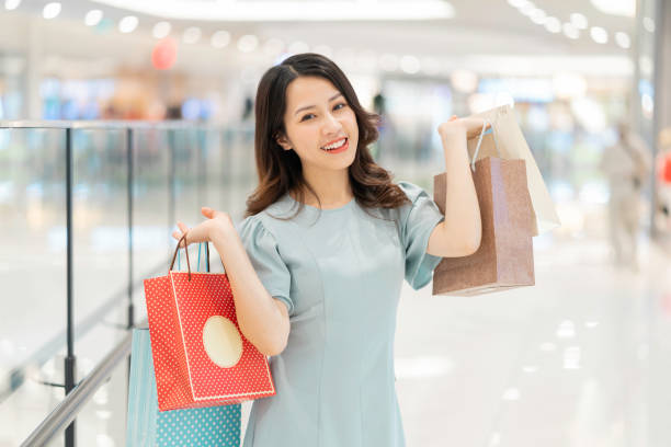 istock Asian woman shopping 1298284384