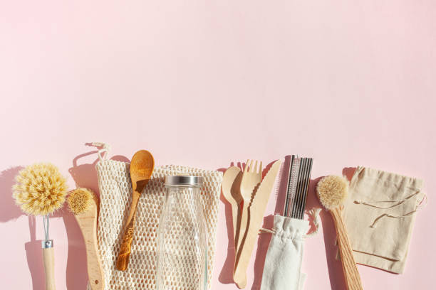 istock zero waste eco friendly cleaning kitchen concept. wooden brushes, drinking straw, cotton bags 1298287095