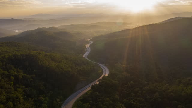 Hyperlapse of winding road valley in sunrise