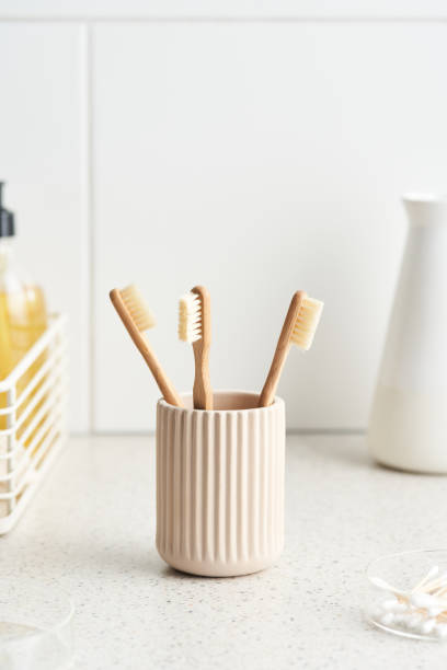 istock Bamboo toothbrushes in bathroom in morning 1298290640