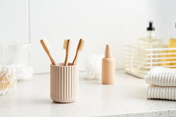 istock Eco friendly toothbrushes and towels in bathroom 1298290649