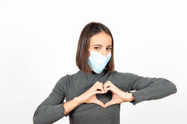istock Hispanic girl with a face mask during pandemic 1298293689