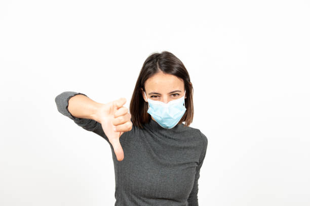 istock Hispanic girl with a face mask during pandemic 1298293918