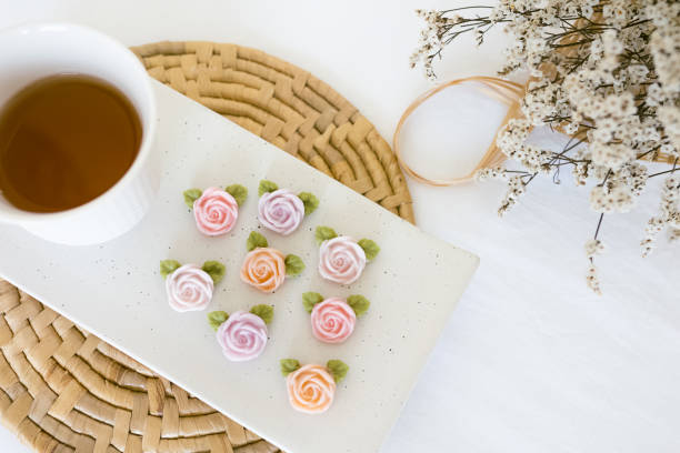istock rose shape allure with hot tea, thai dessert 1298295221