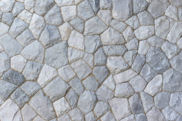 灰色の石壁または岩の床のテクスチャの背景の表面 - stone cobblestone material rock ストックフォトと画像
