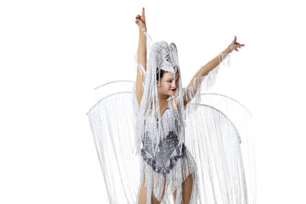 Beautiful young woman in carnival, stylish masquerade costume with feathers dancing on white studio background. Concept of holidays celebration, festive time, fashion Pointing. Beautiful young woman in carnival, stylish masquerade costume with feathers dancing isolated on white background. Concept of holidays celebration, festive time, dance, party, fashion partytime stock pictures, royalty-free photos & images