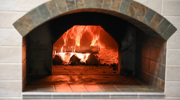 istock Burning firewood in russian oven. 1298302029