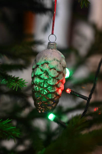 istock Decorative bump toy hanging on decorated Christmas tree. Close-up. 1298302053