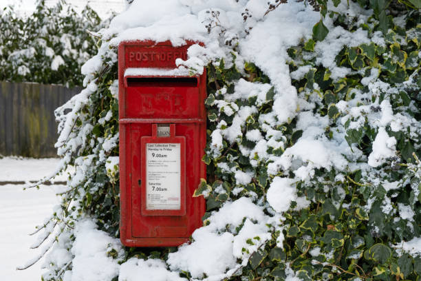 istock Traditional British red post box in winter snow 1298302806