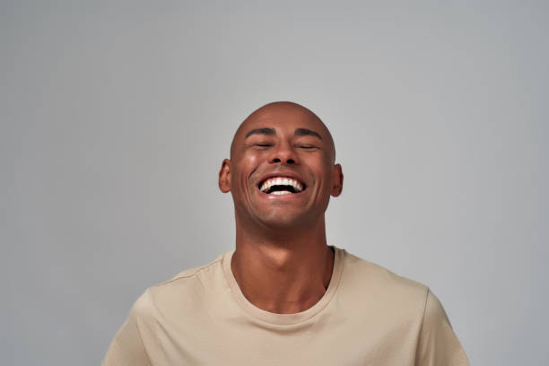 istock Multiethnic person laughing out loud with raised head 1298304008
