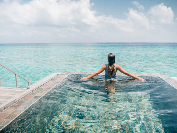 istock Woman enjoying luxury vacations 1298305477