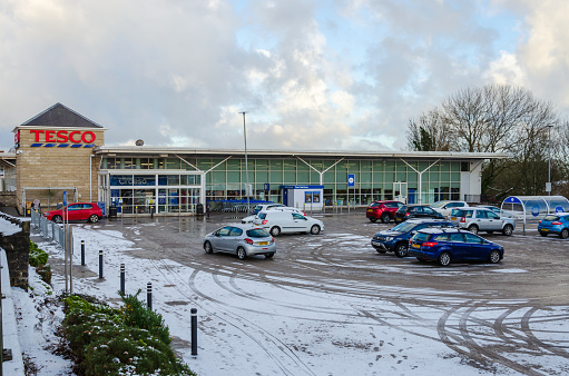 Holywell; UK: Jan 25, 2021: The North Wales town of Holywell had snow fall overnight. Car parks were left with a blanket of snow.