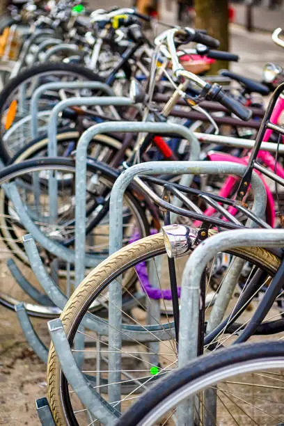 Photo of Holland Traveling. Line of Traditional Bicycles in Amsterdam in the Netherlands. Vertical Image