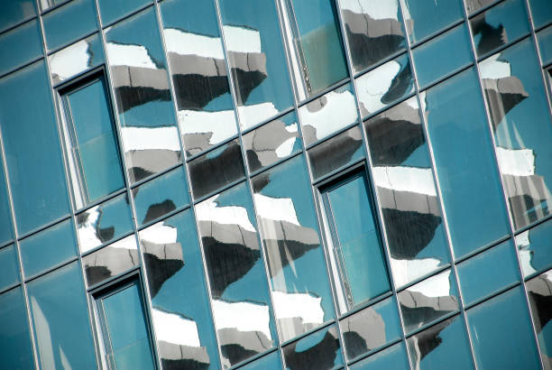 istock Modern multistory building facade with reflections. Glass building facade. 1298306267
