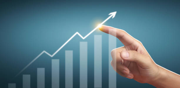 istock Hand touching  graphs of financial indicator and market analysis chart 1298307406