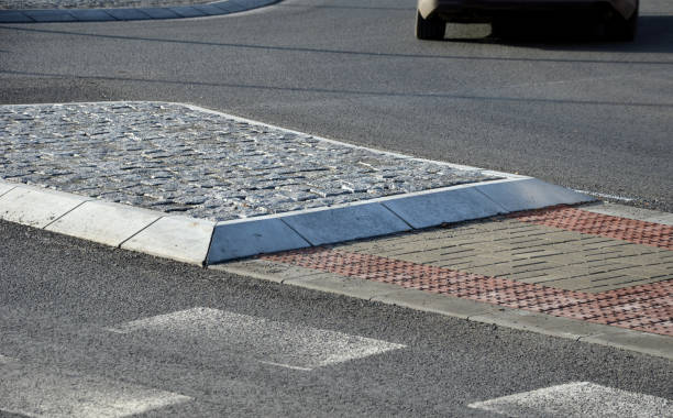 istock navigation tactile tiles strip for blind and disabled pedestrians who have vision problems. The red pavement has protrusions that lead the person to the crossing and draw attention to the edge road 1298307512