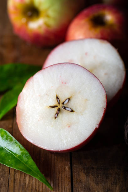 Red apple with leaf on white background