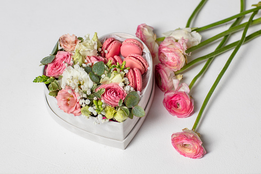 heart shape box with flowers and macaroons