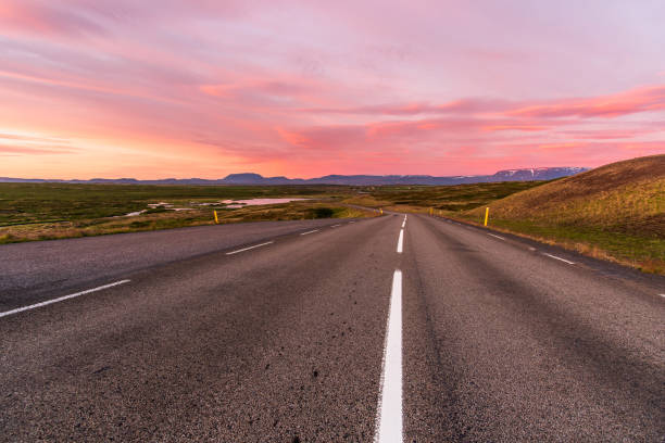 istock Stunning summer sunset over a deserted mountain road in Iceland 1298311111