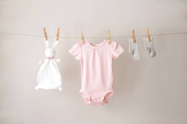 istock Baby clothes hanging on the rope. 1298311182