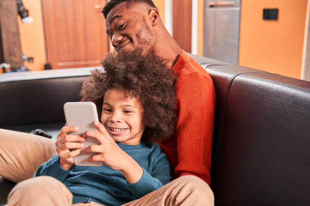 istock Child enjoying weekend at home with his father 1298312460