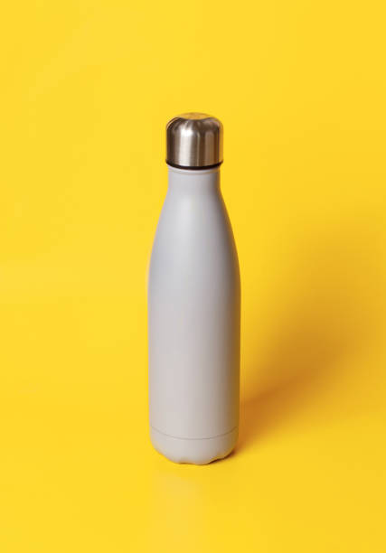 istock Grey insulated bottle on yellow background 1298312776