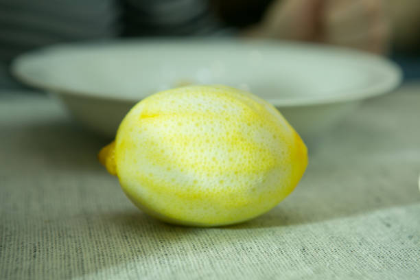 the process of making limoncello lemon liqueur at home. lemon without zest. - n64 imagens e fotografias de stock