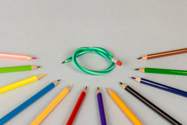 istock Multicolor pencils and flexible pencil on a light background. Close up. Selective focus. 1298314113