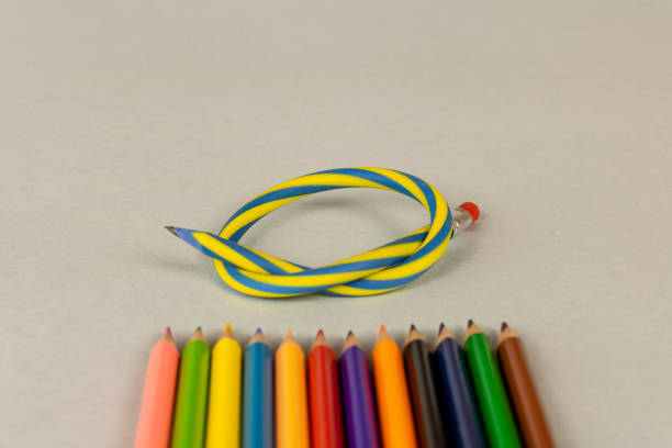 istock Multicolor pencils and flexible pencil on a light background. Close up. Selective focus. 1298314136