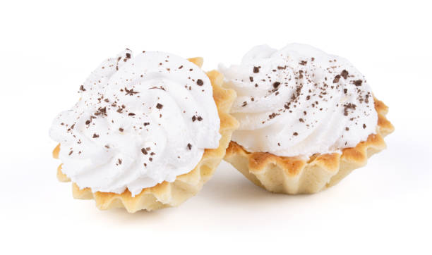 istock Two tasty Cupcake with butter cream and chocolate chips isolated on white background 1298314633