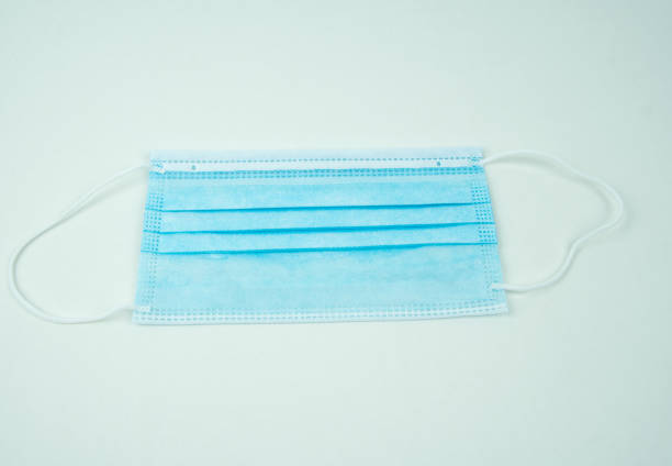 istock Surgical mask and cotton swab 1298314885