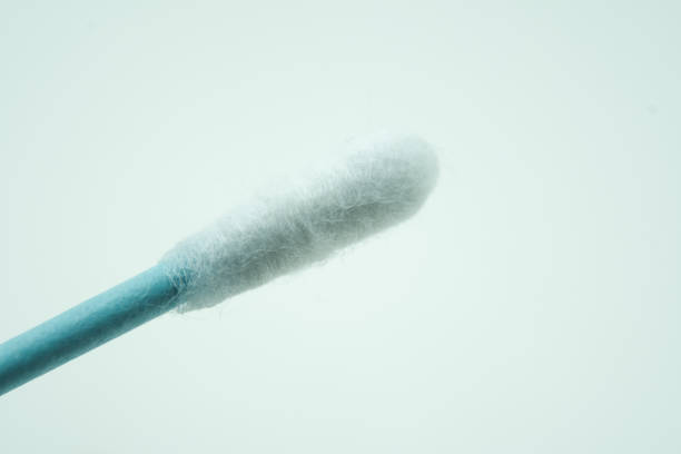 istock Surgical mask and cotton swab 1298314910