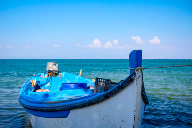 istock Front side of angling ship bow in clean sea water 1298320519