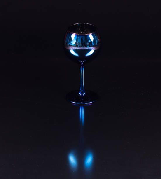 istock blue wine glasses isolated on black background 1298323755