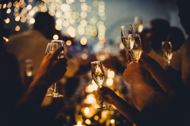 https://media.istockphoto.com/id/1298329786/photo/wedding-celebratory-toast-with-string-lights-and-champagne-silhouettes.jpg?s=612x612&w=0&k=20&c=DN-V9iE_tnfuTyPZ3vRwpdszHW6efDs2zzDCI1OHUQA=