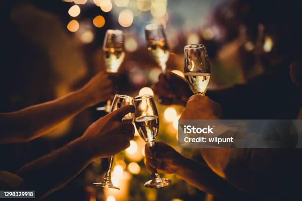 Birthday Celebratory Toast With String Lights And Champagne Silhouettes Stock Photo - Download Image Now